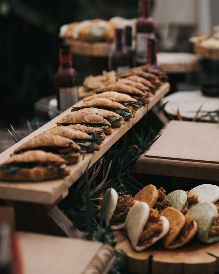 Artistic display of gourmet sandwiches on wooden platters in a Turkish restaurant, Antalya.